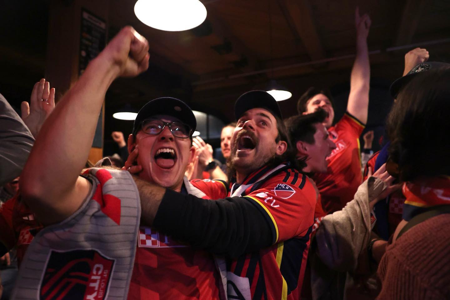 Austin Burgard cheering on STL SC at a bar